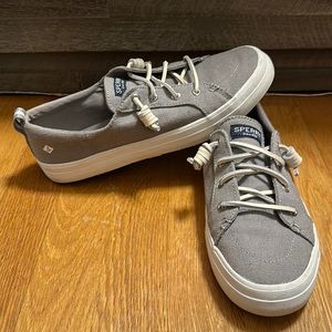 Light gray Sperry shoes with leather laces